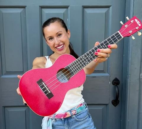 woman with pink guitar 