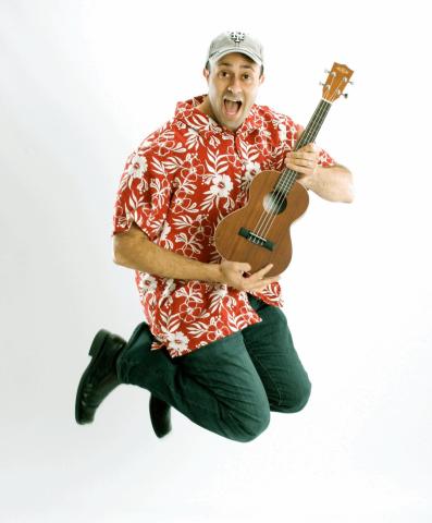 man in Hawaiian shirt with guitar 