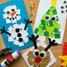 white paper square snowman on blue paper