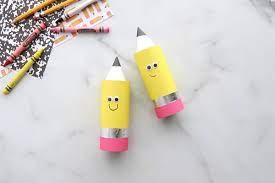 yellow and pink cardstock wrapped around a craft tube